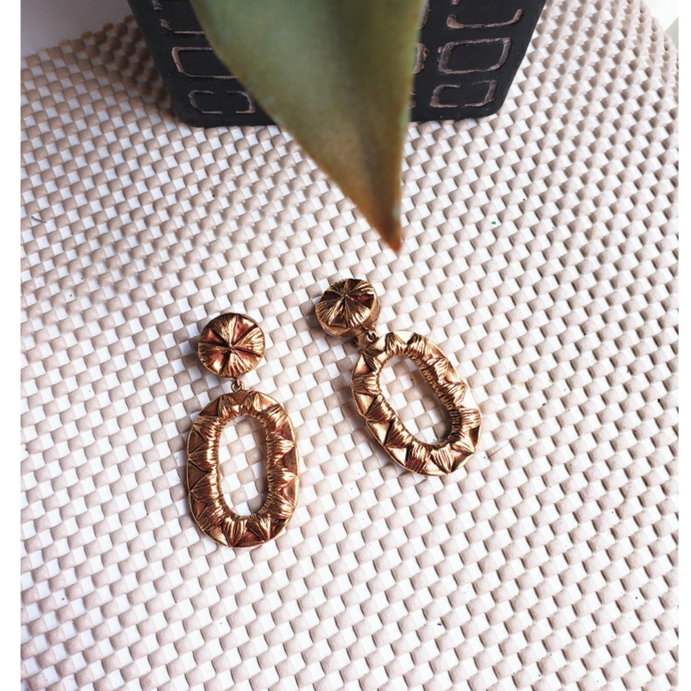 Gold colored clip on earrings